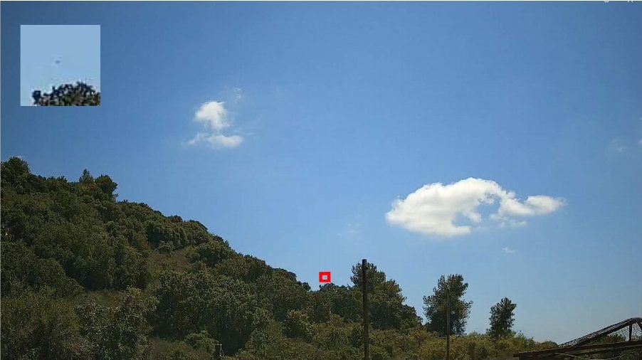 Drone detection field test: Day-channel frame with a drone detected near the hillside, marked with a red box and a zoomed inset